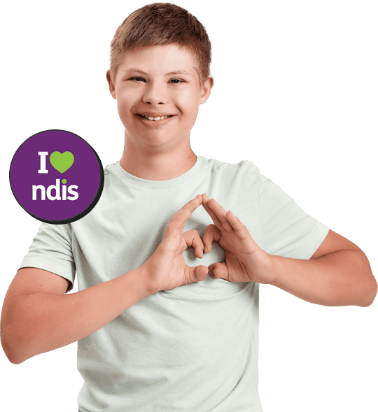 A boy with National Disability Insurance Scheme (NDIS) making a heart shape with his hands.